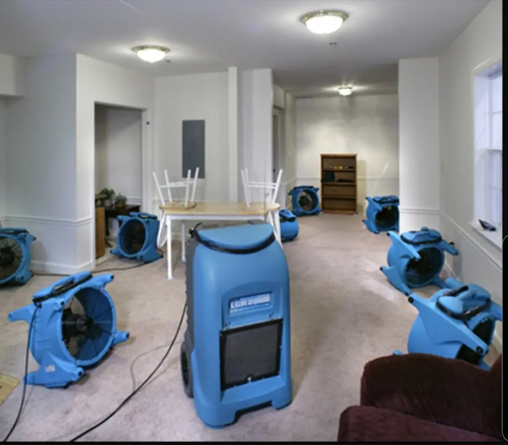 Air movers and dehumidifier setup for Water Damage Restoration in Joshua